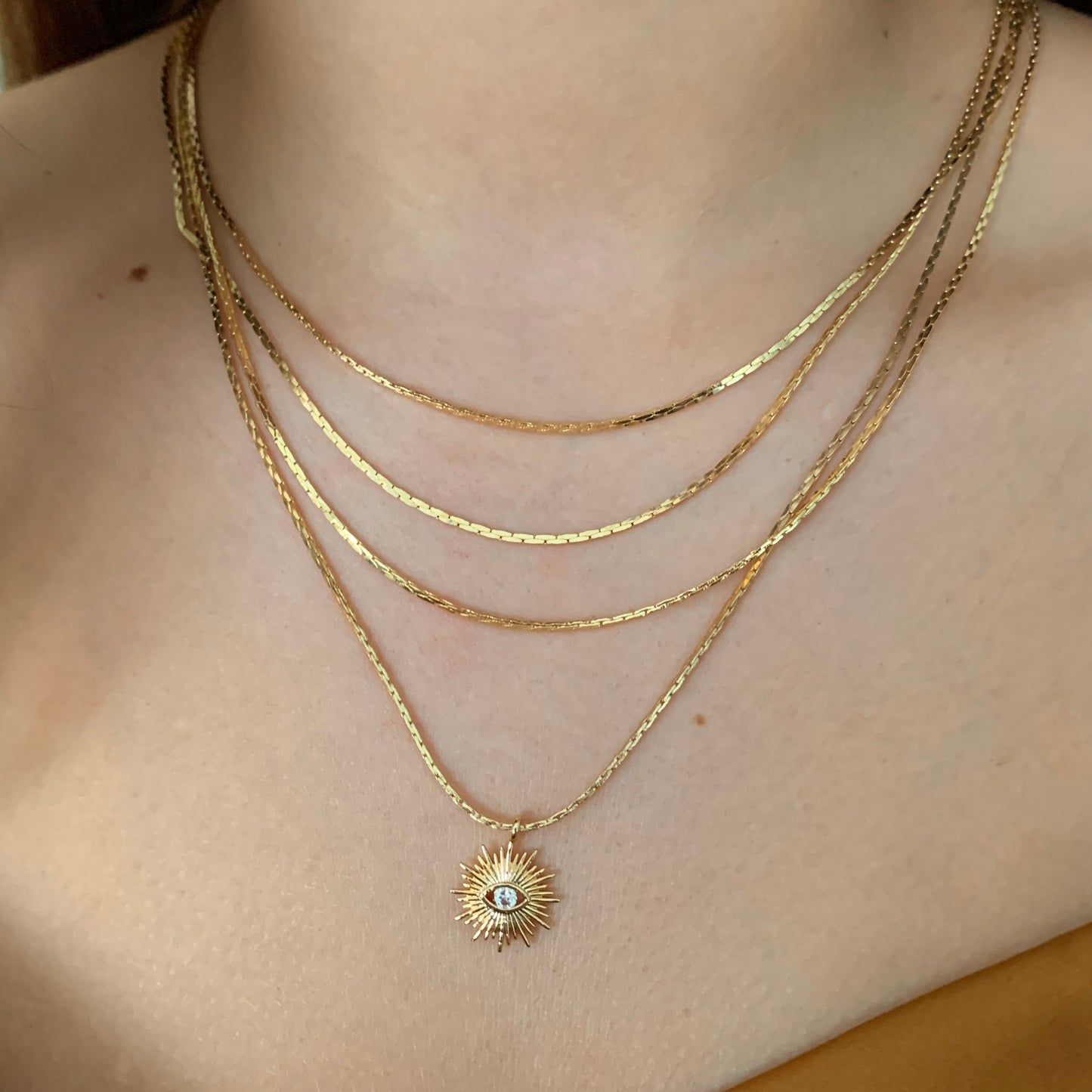 Collar LAYERING con dije de SOL y OJITO