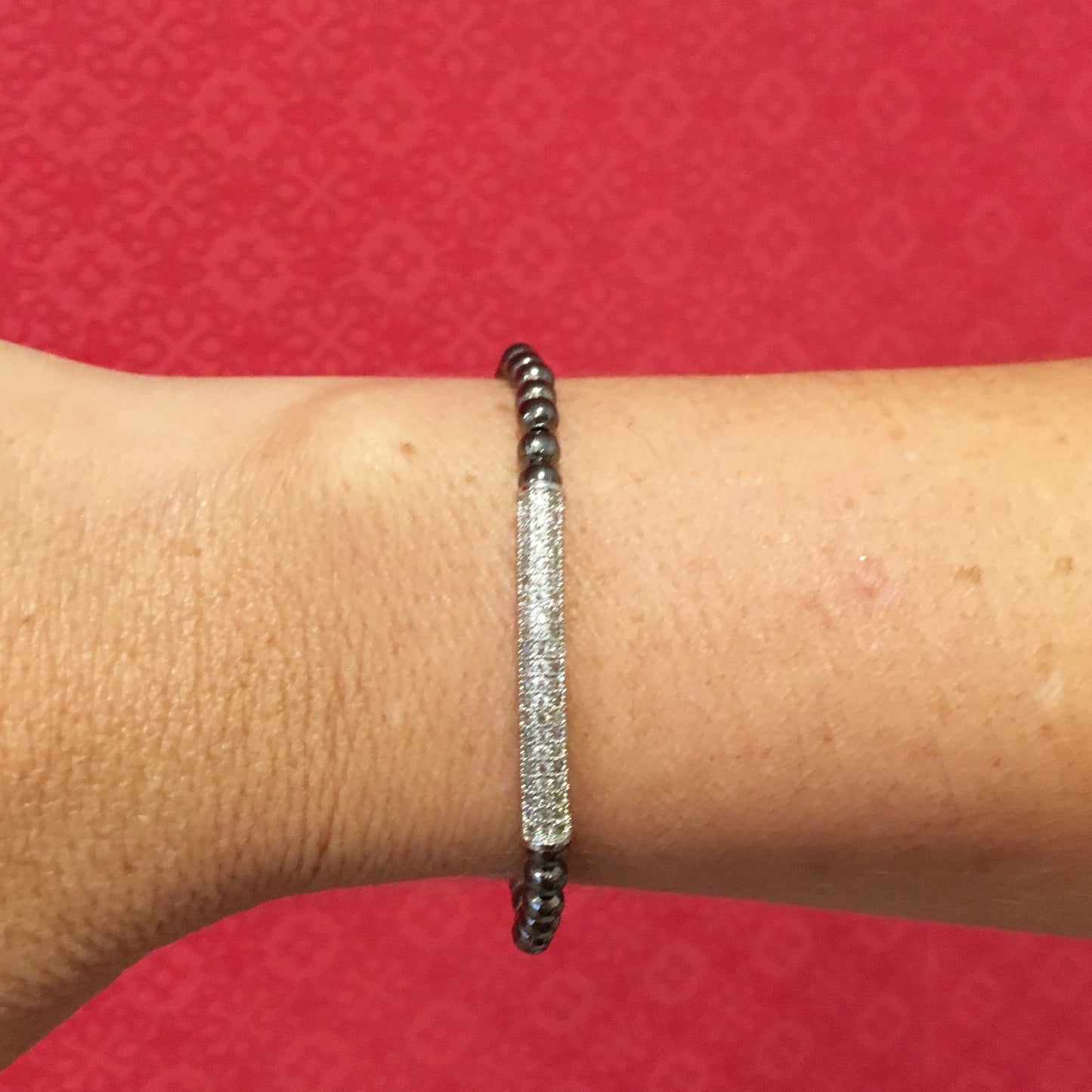 Pulsera de BOLITAS de acero con BARRA CHICA de zirconias