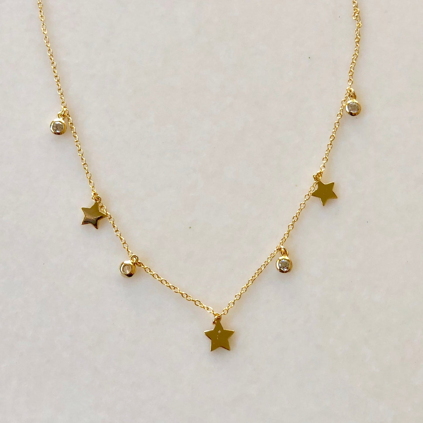 Cadenita CHOKER de plata con ESTRELLAS y ZIRCONIAS colgantes